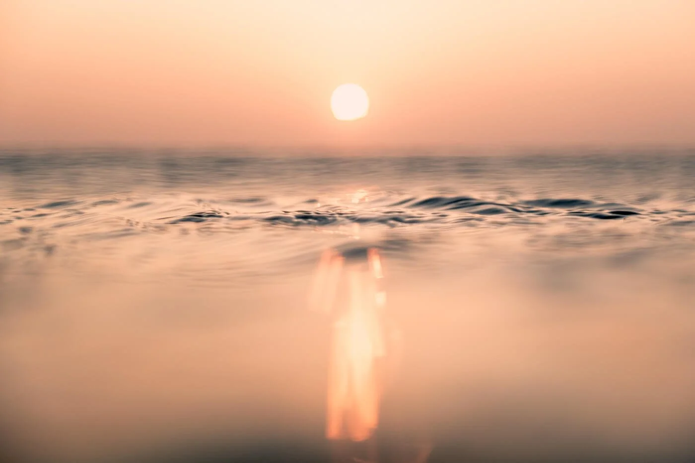 water surface reflections at sunrise photographed with 16–55mm lens in in-water photography