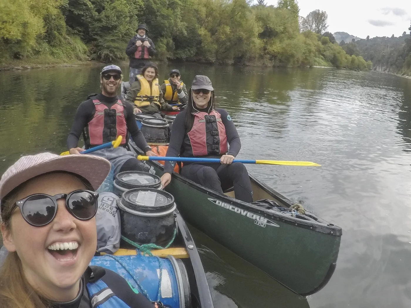 Group canoeing the Whanganui River on the multi-day Whanganui Journey in New Zealand.