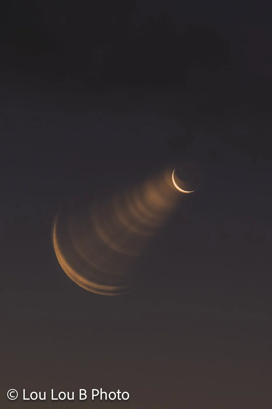 Abstract crescent moon photograph with repeated golden moon shapes fading diagonally through a dark night sky.