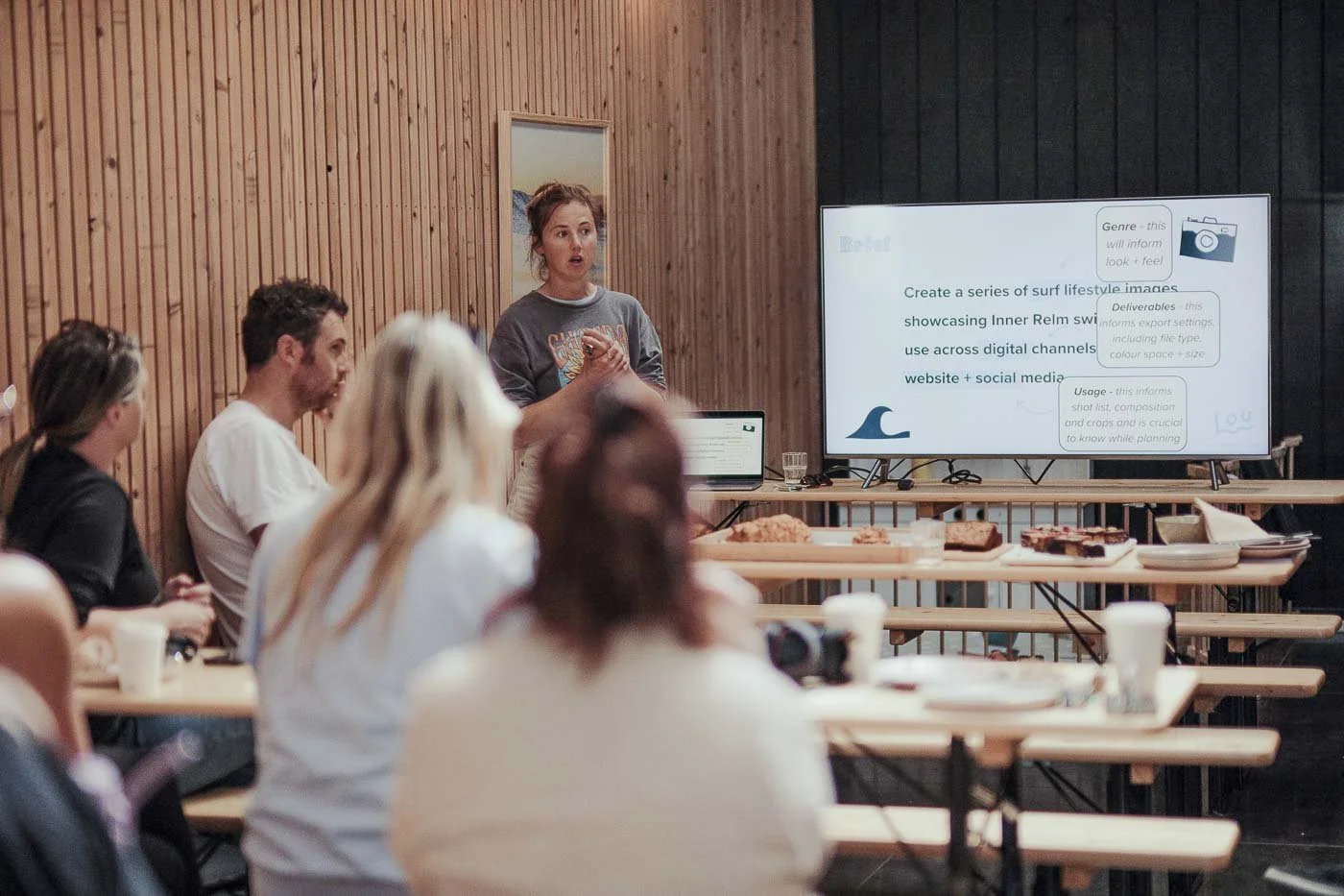 photography workshop session reviewing campaign brief during Nostalgic Surf styled surf photography masterclass classroom learning environment brand shoot planning