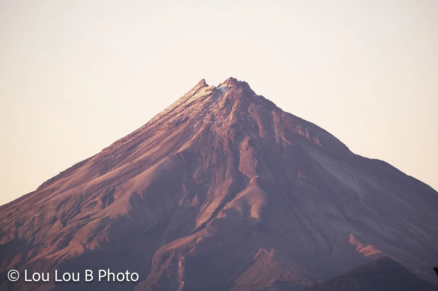 Mount Taranaki illuminated by warm morning light, Taranaki, New Zealand