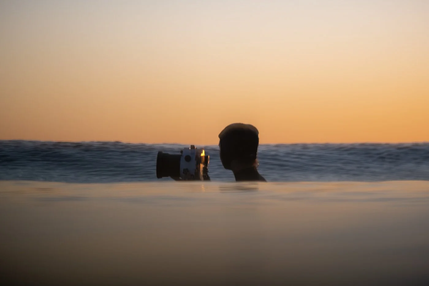 beginner surf photography mistakes shooting from water level with camera housing