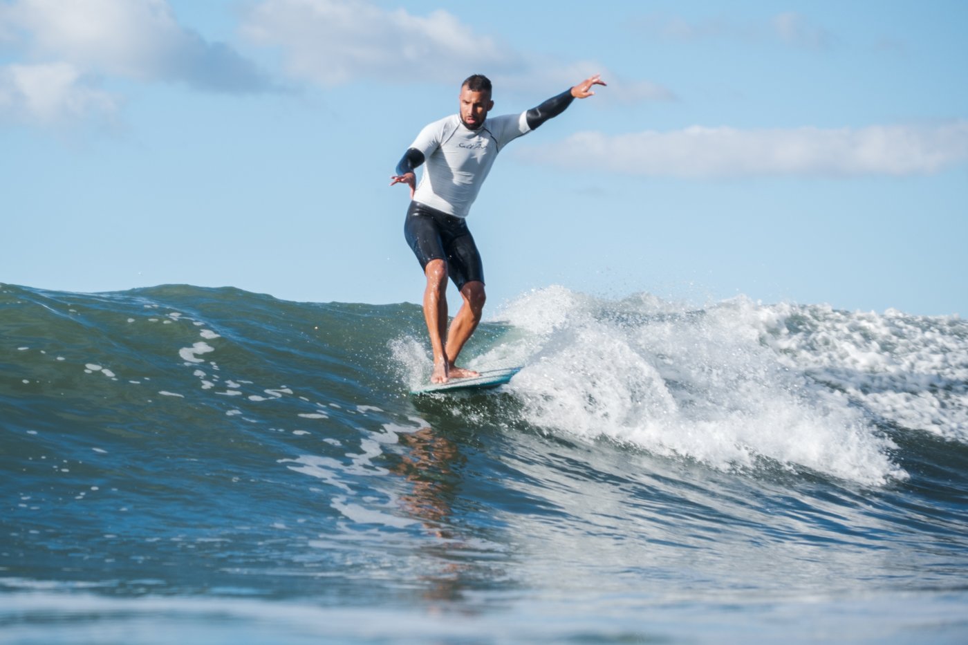 surfer riding wave during West End Wiggle men’s finals surf photography inside lineup positioning example