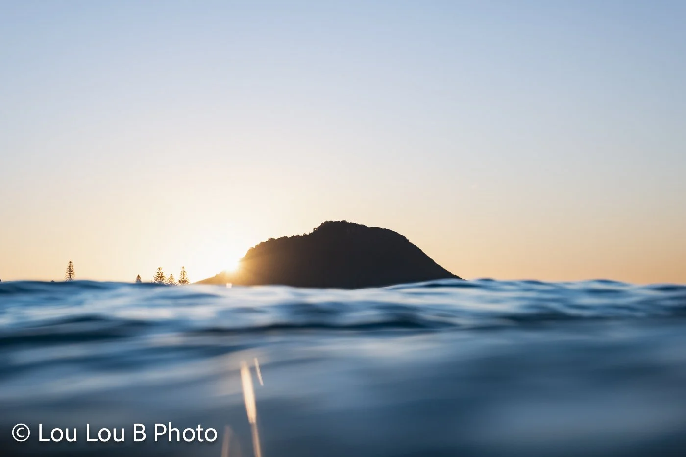Mauao at sunrise viewed from the ocean, Mount Maunganui, New Zealand