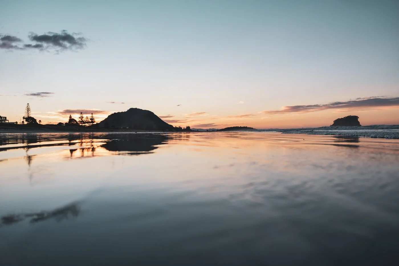 Low tide reflections beside Mauao at Marine Parade Beach Mount Maunganui during early morning light