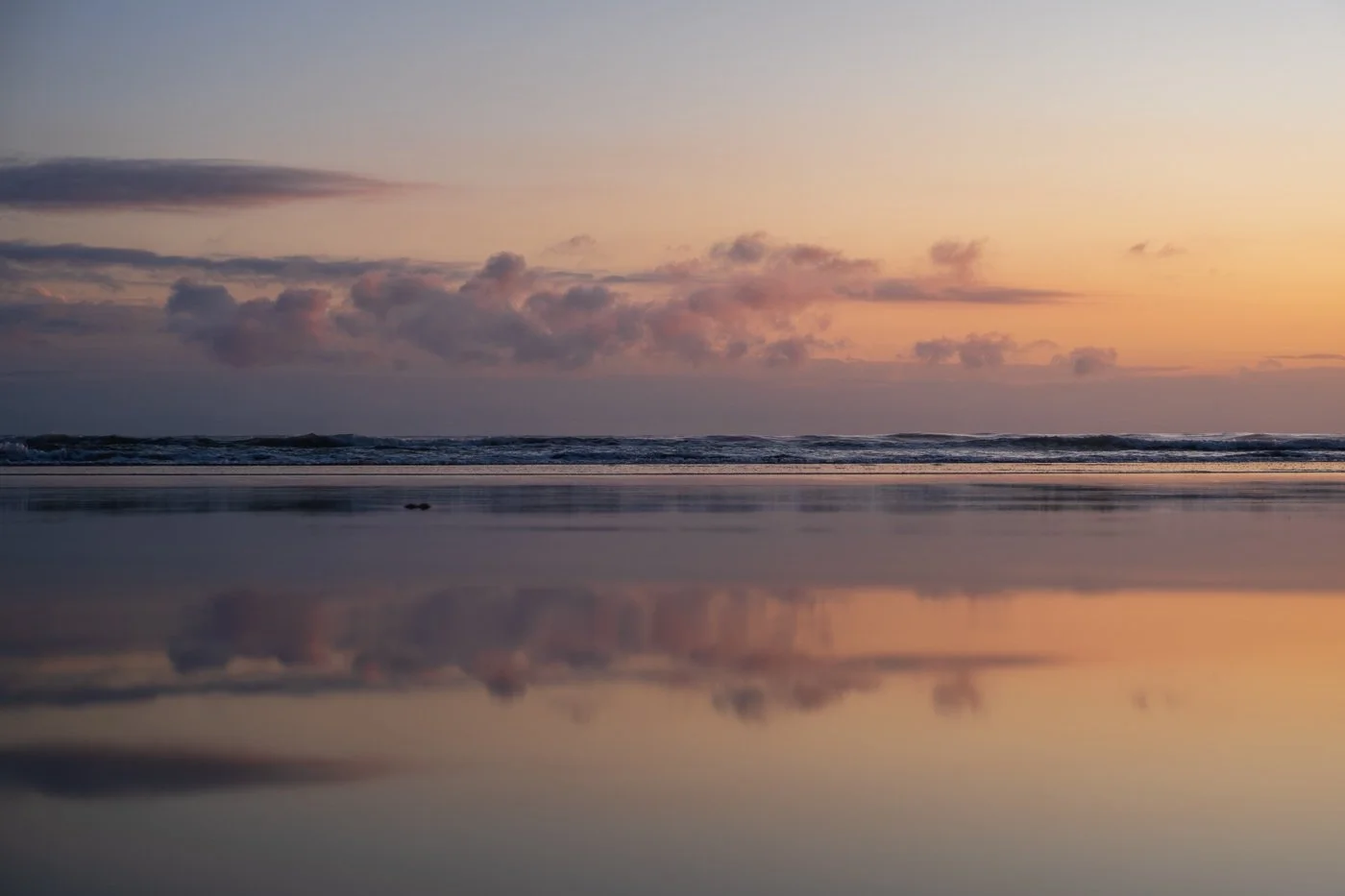 Pastel sunrise reflections at Main Beach Mount Maunganui during autumn and winter morning light