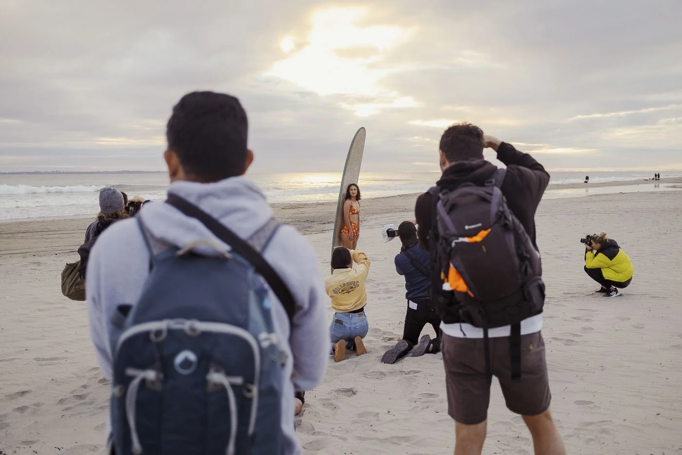photographers adapting to changing morning light during Nostalgic Surf styled surf photography workshop beach portrait setup real time shoot adjustments