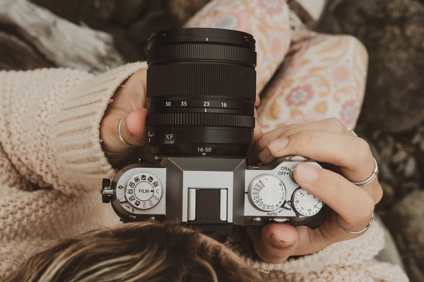 Fujifilm X-T50 with XF 16–50mm lens showing film simulation dial and tactile controls