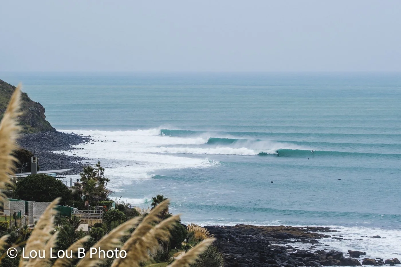 Surf breaking along the Raglan coastline, Waikato, New Zealand