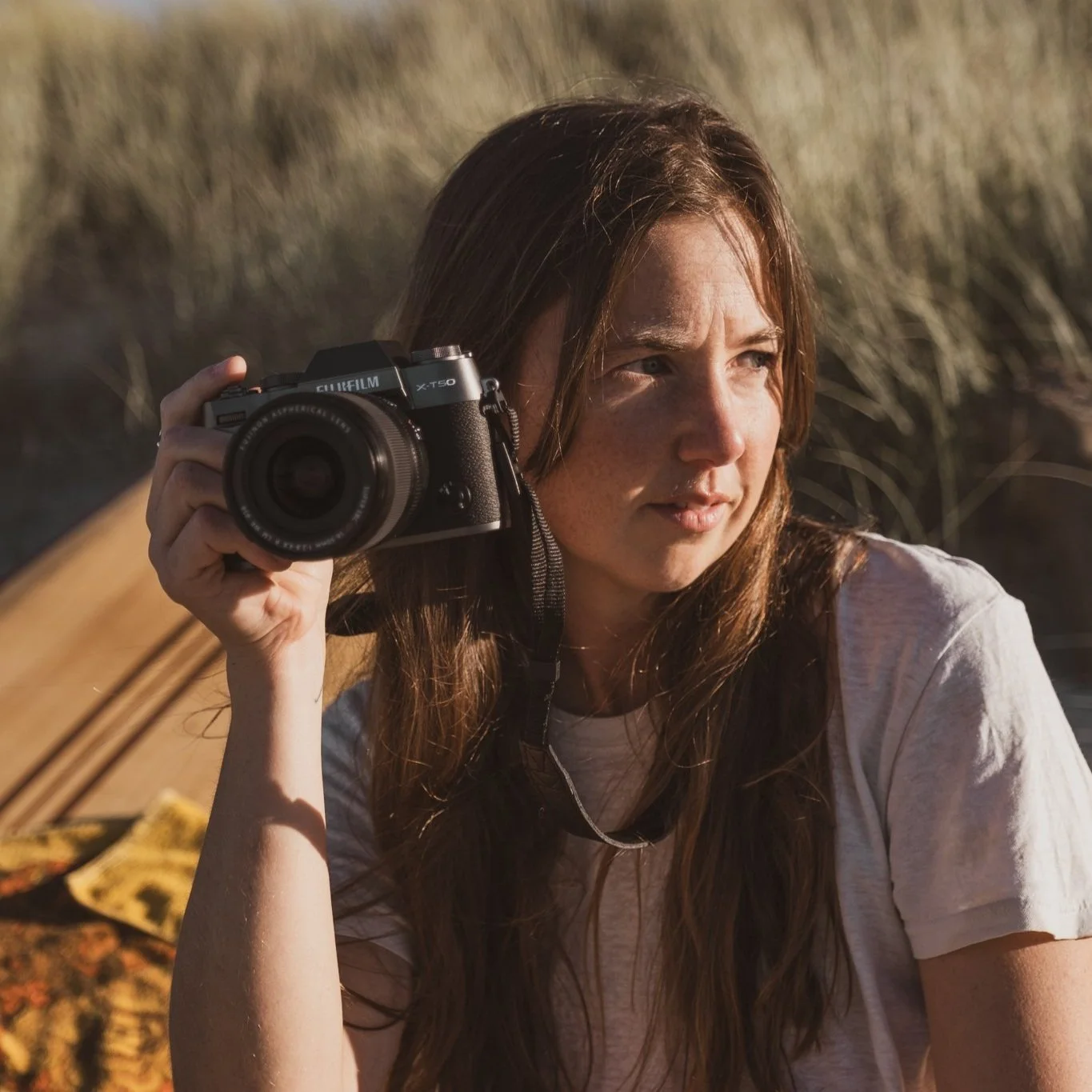 New Zealand ocean and surf photographer Lou Lou B shooting coastal imagery at the beach with Fujifilm X-T50 camera