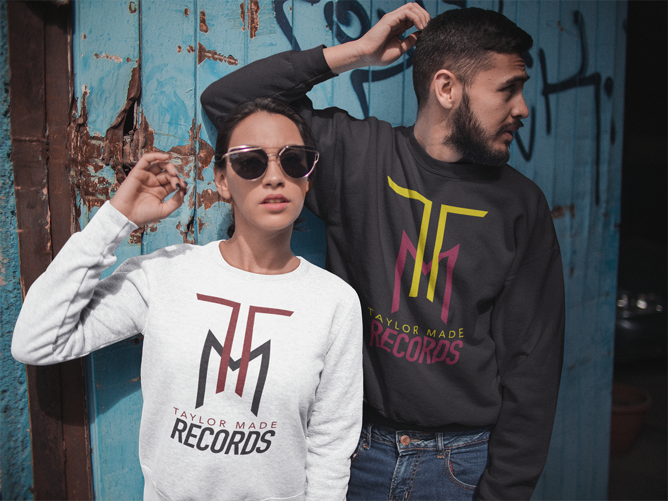 hispanic-couple-wearing-different-crewneck-sweatshirts-mockup-while-standing-against-an-old-door-a15532.png