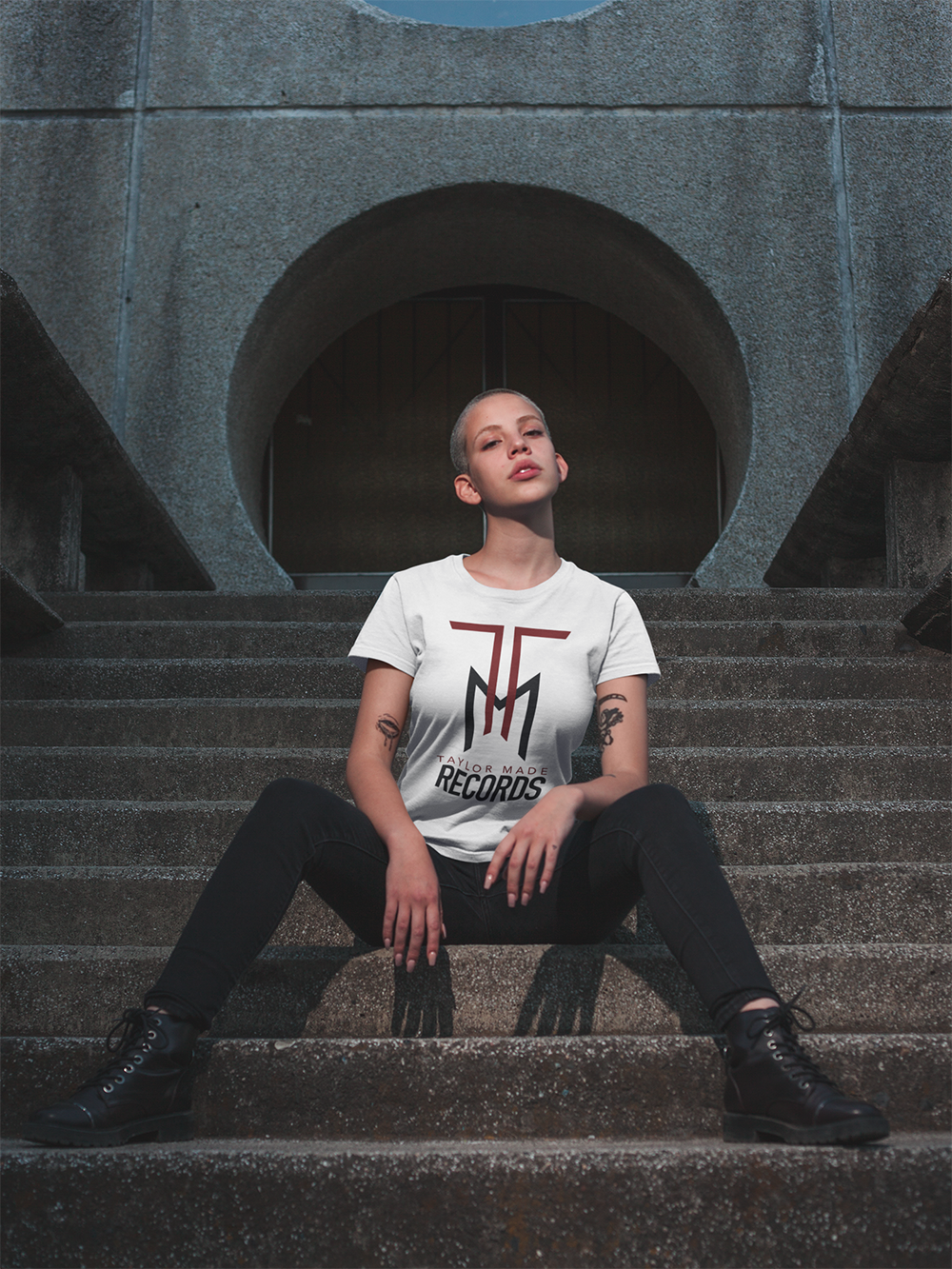 mockup-of-a-trendy-girl-with-tattoos-wearing-a-t-shirt-on-street-stairs-18123.png