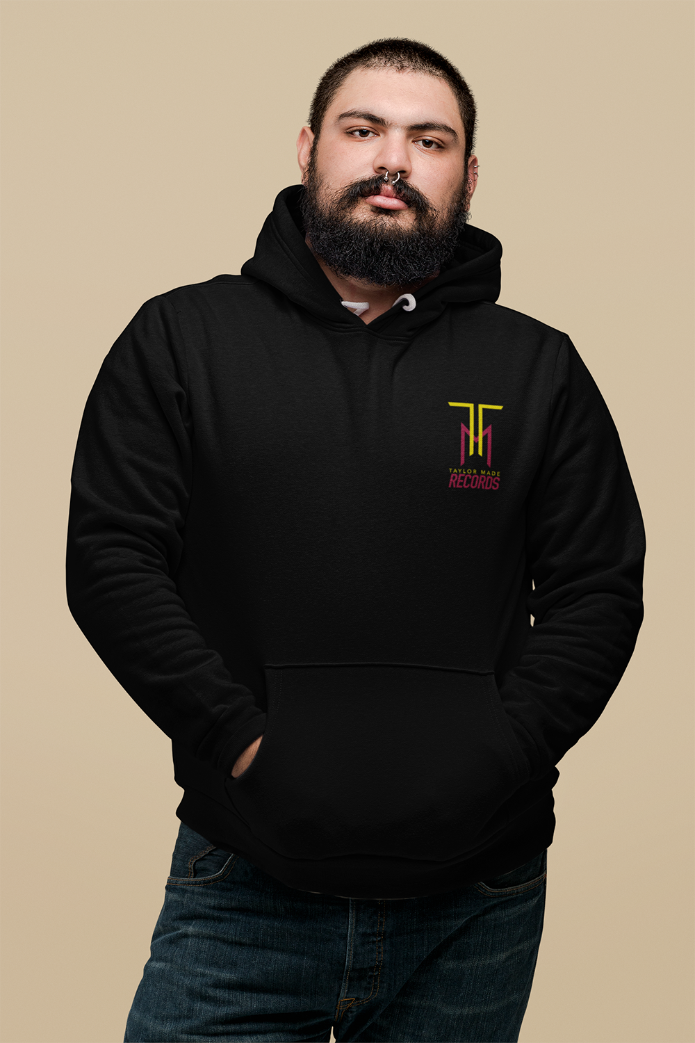 plus-size-hoodie-mockup-of-a-man-with-a-septum-piercing-against-a-flat-wall-27758.png
