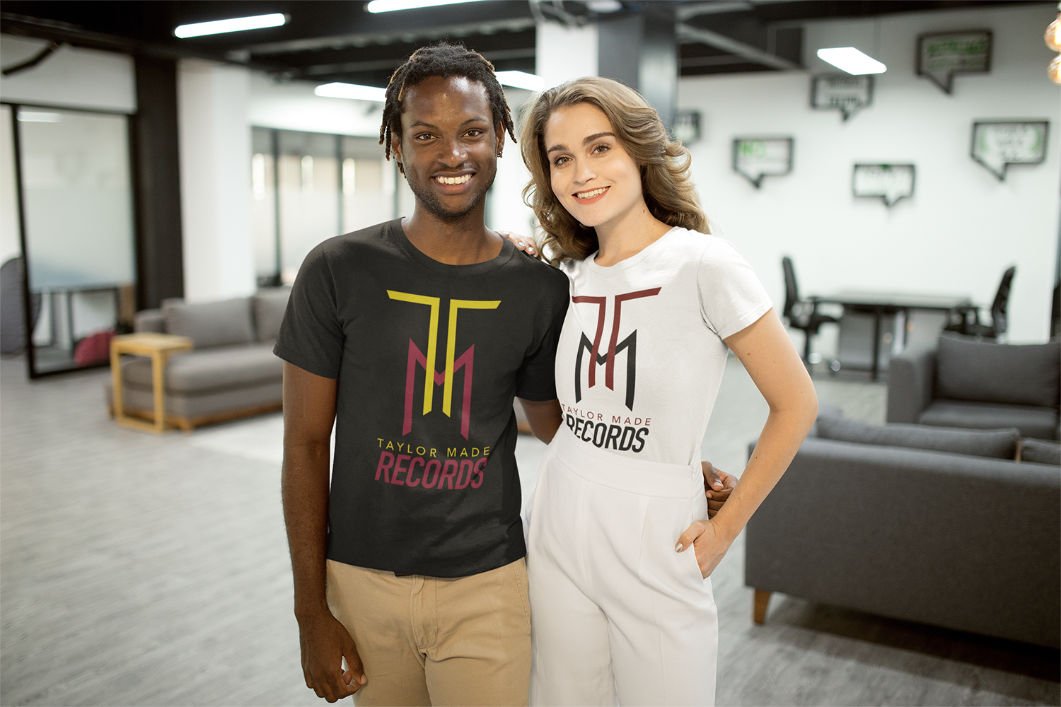 smiling-interracial-couple-wearing-t-shirts-mockup-at-the-office-a20522.png