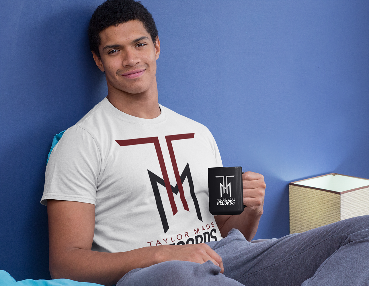 t-shirt-mockup-of-a-man-holding-a-15-oz-mug-in-bed-29260.png