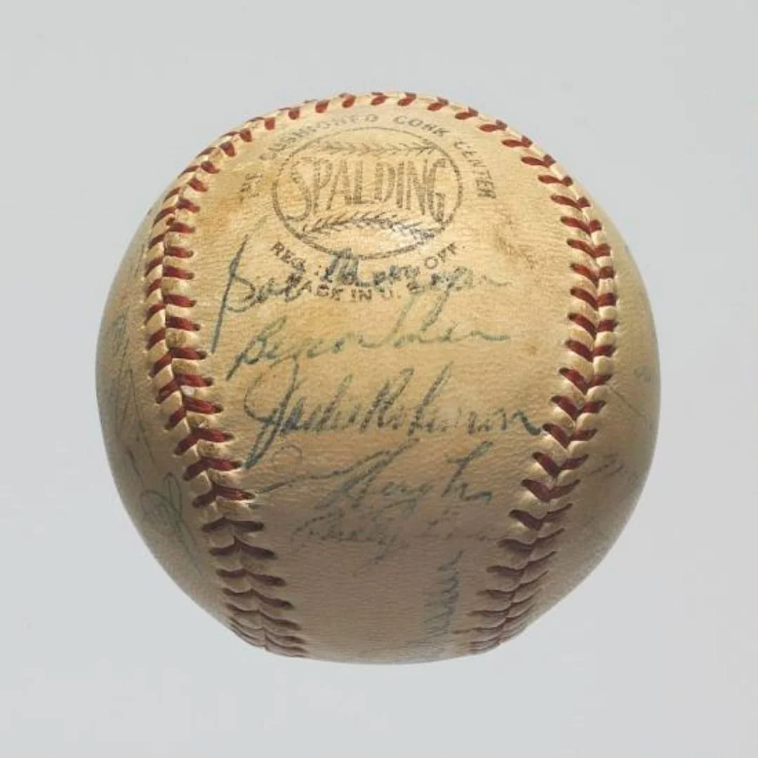 Autographed vintage Brooklyn Dodgers baseball illustrating sports memorabilia and primary source artifacts for a sports person biography.