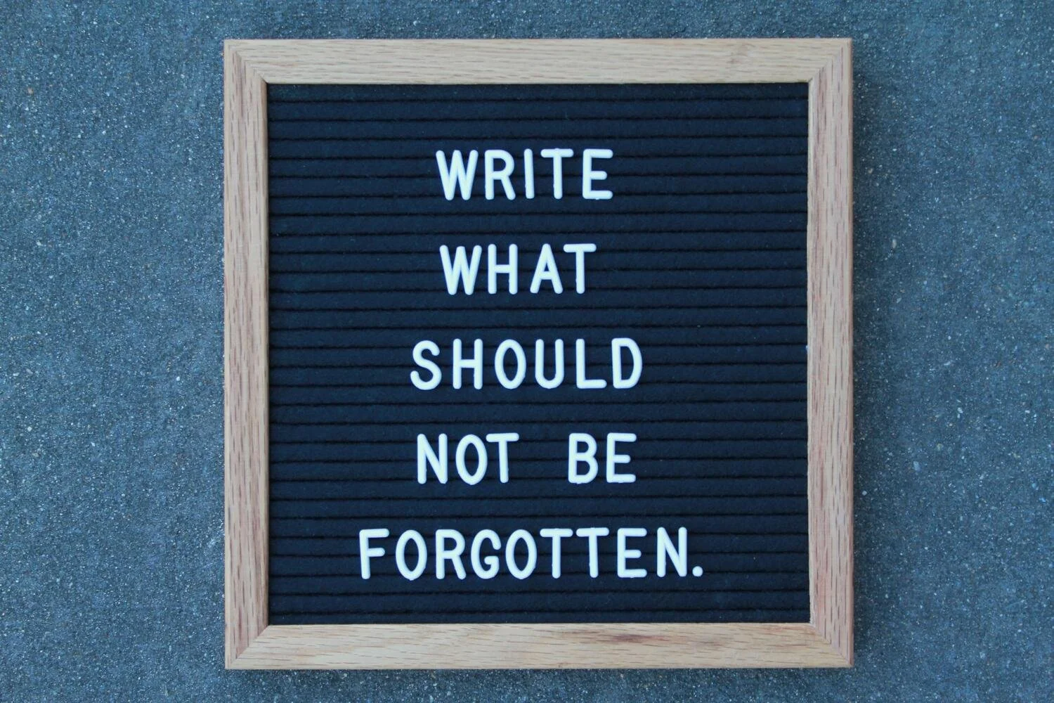 A letterboard reading “Write What Should Not Be Forgotten,” to inspire people writing family history books.