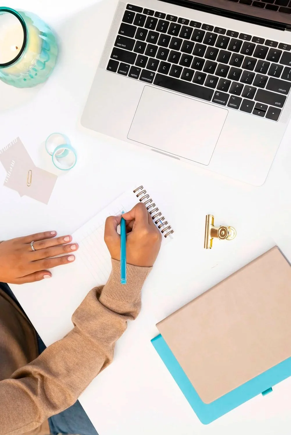 Photo representing an Amazon kdp author writing on a notebook following self-publishing tips