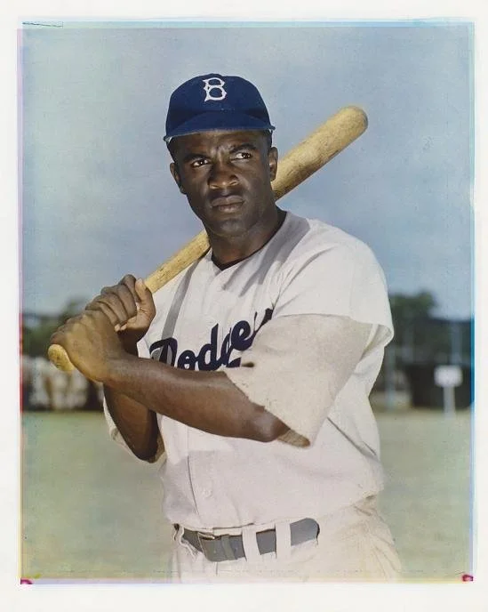 Historical photo of Jackie Robinson demonstrating how to write a sports biography that explores character, culture, and life beyond game statistics.