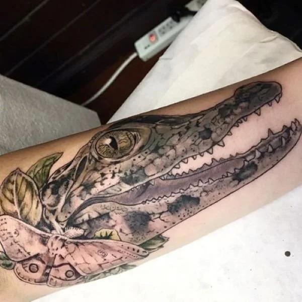 lifelike reptile head tattoo