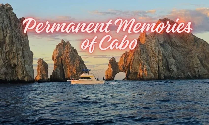 Sportfishing boat driving by Cabo Arch