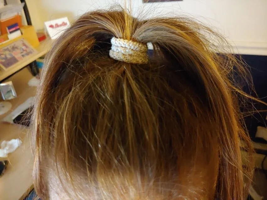 Hanna's ponytail is under control. Long red hair not tangled.