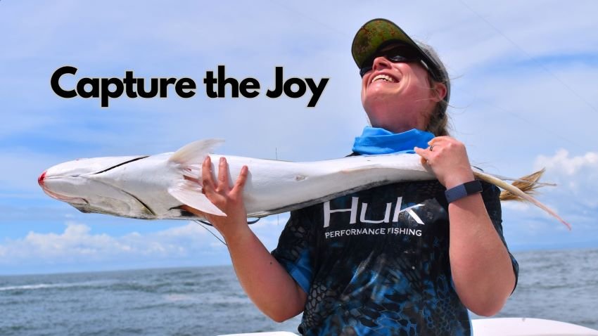 Smiling female anglers dropping a roosterfish