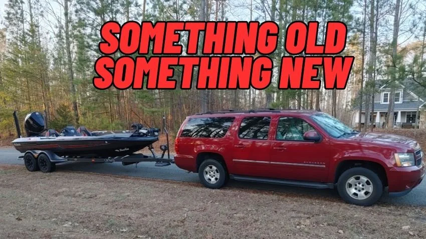 2011 Chevrolet Suburban pulling a 2022 Bass Cat Boats Puma STS