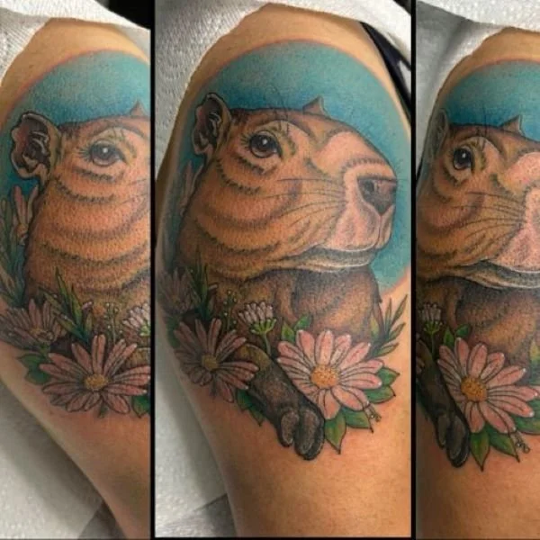sleeve tattoo capybara and flowers