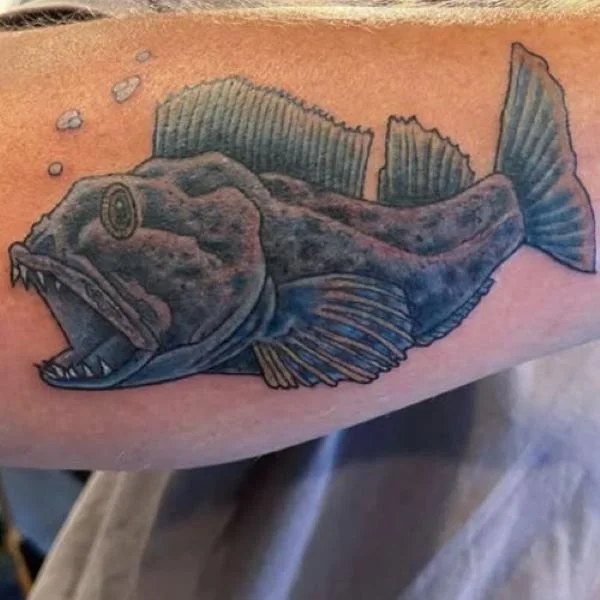 blue cartoon lingcod tattoo
