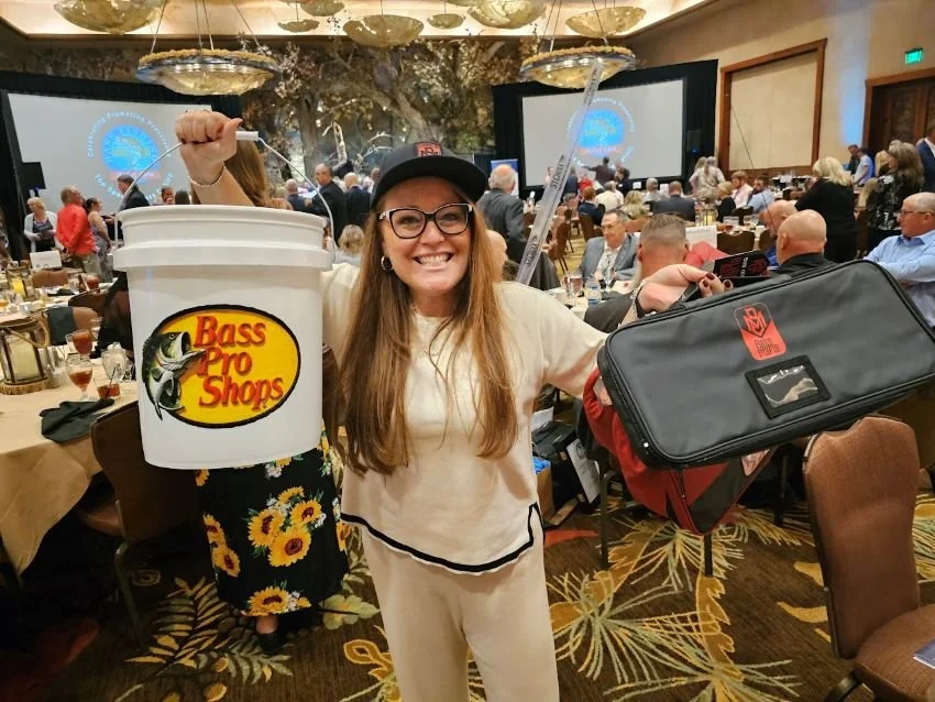 Hanna Robbins at Wonders of Wildlife with Bass Pro Shops Bucket and Bass Mafia binder