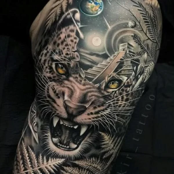 Black and white tattoo of Amazon jaguar with mouth open