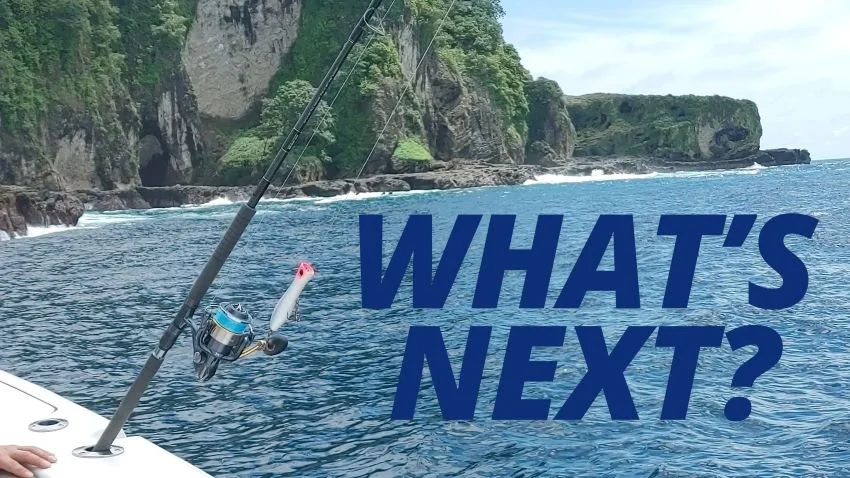 Spinning rod with YoZuri popper in a rod holder