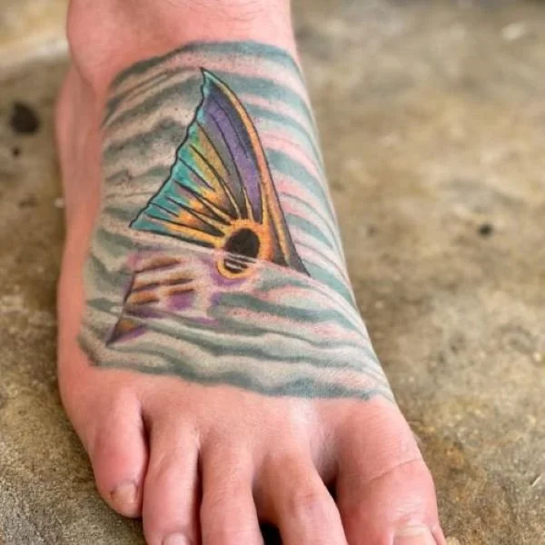 tailing redfish tattoo on a foot