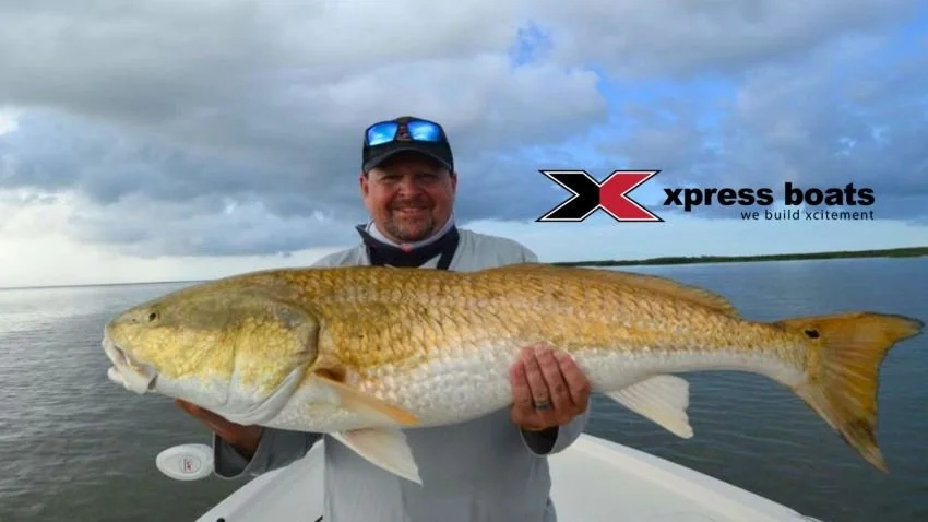 Mark Copley of Xpress boats with a trophy Venice LA redfish