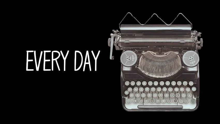 Image of an antique typewriter on a black background