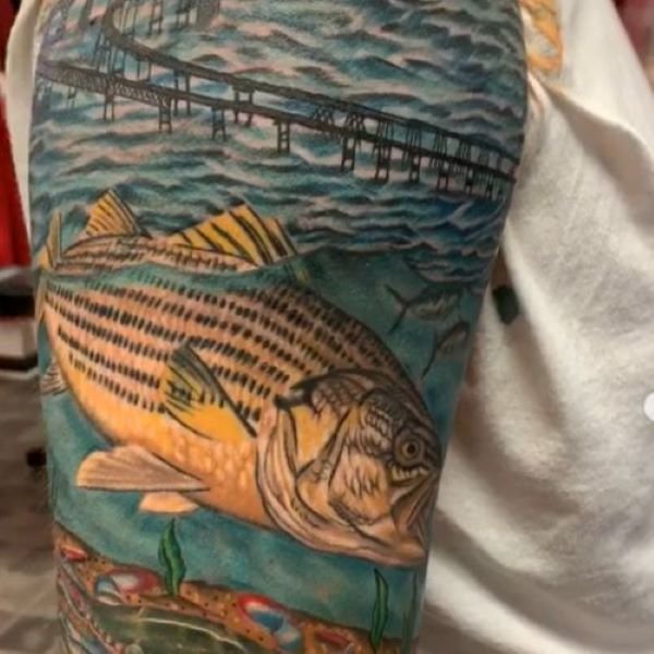 Tattoo of rockfish under Chesapeake Bay Bridge feeding