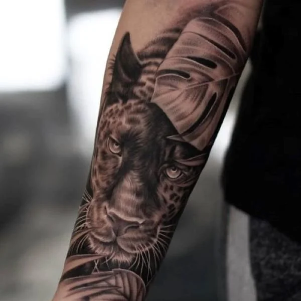 Forearm jaguar tattoo