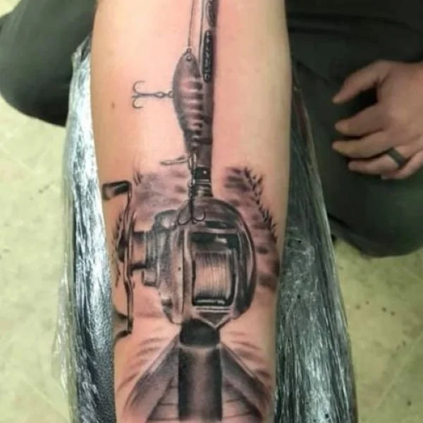 Donald Johnson black and white tattoo of whopper plopper on baitcasting rod and reel