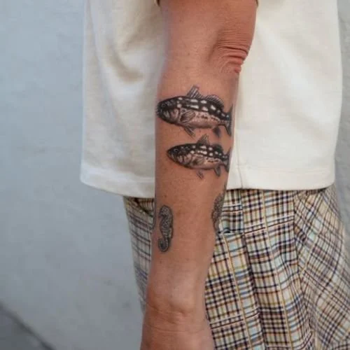 Calico bass fish sleeve tattoo
