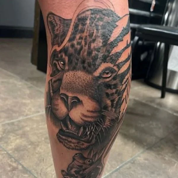 Realistic big cat jaguar tattoo leg