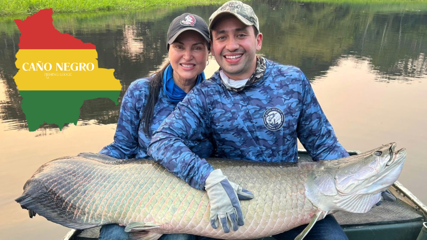 Couple with an Arapaima caught in the Bolivian Amazon