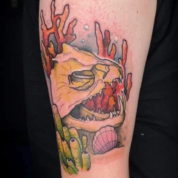 Payara skull tatooo with coral and shells