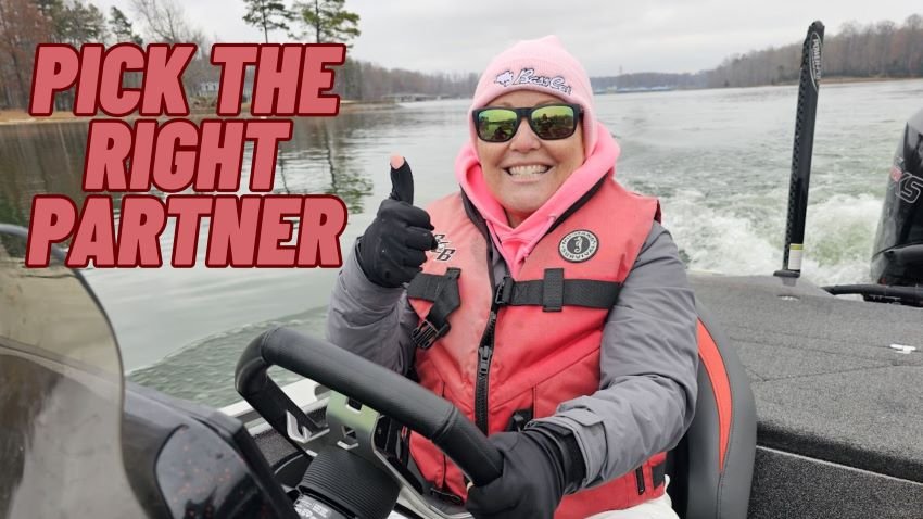 Hanna Robbins driving a Bass Cat boat with a thumbs up