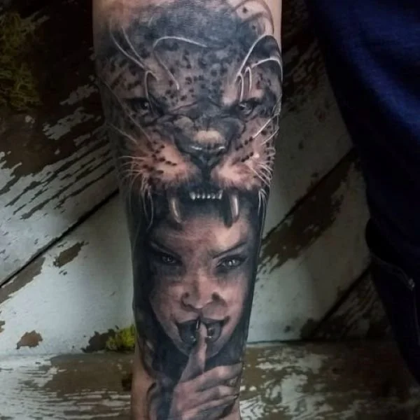 tattoo of jaguar head over face of indigenous woman