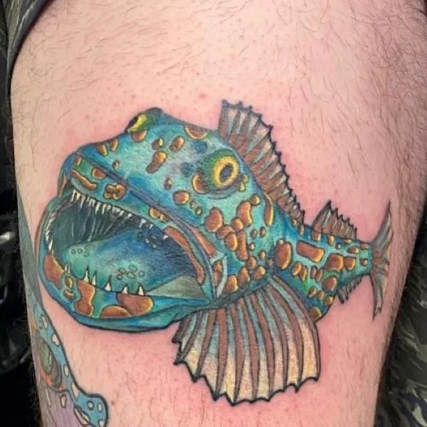 Colorful cartoon lingcod tattoo