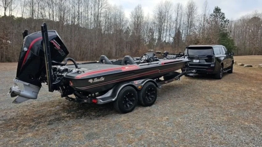 Chevrolet Suburban towing a Bass Cat Puma STS bass boat