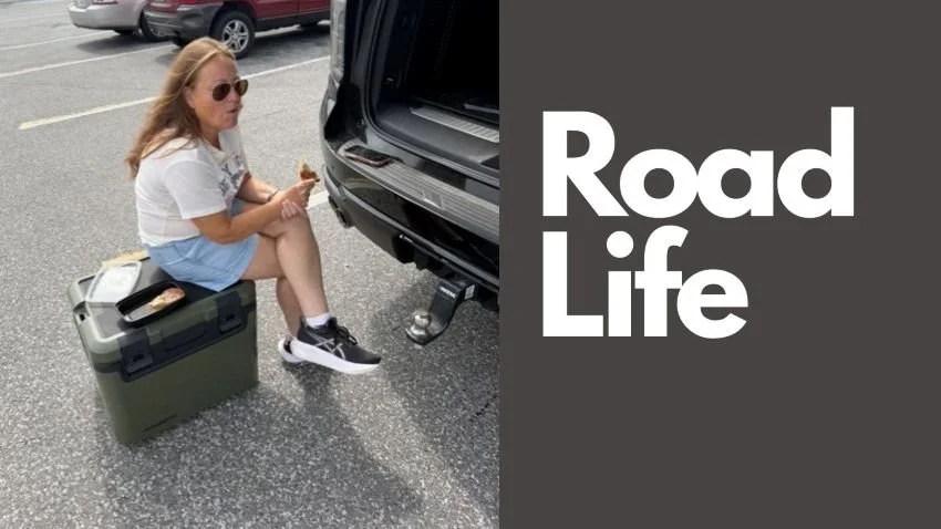 Sitting on a cooler eating pizza in a parking lot