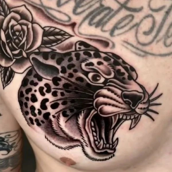 cartoon growling jaguar tattoo