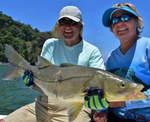 Angler with a snook caught in Chiriqui Panama mangroves